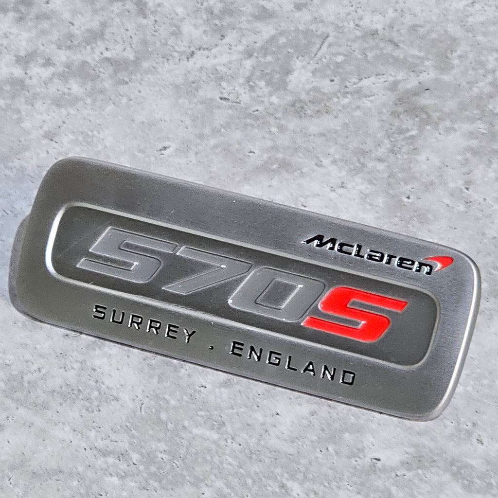 MCLAREN 570S INTERIOR BADGE - SILVER/ RED 13N2902CP