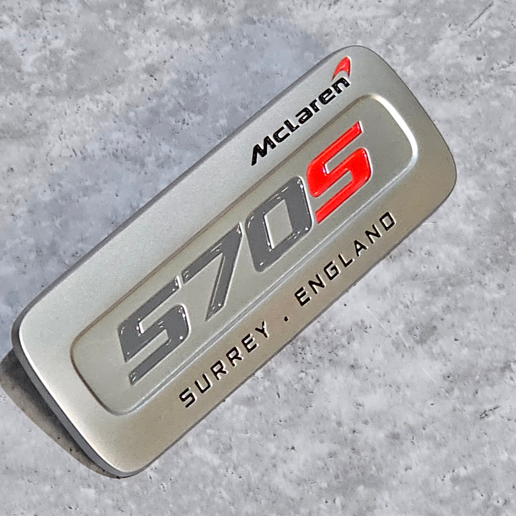 MCLAREN 570S INTERIOR BADGE - SILVER/ RED 13N2902CP